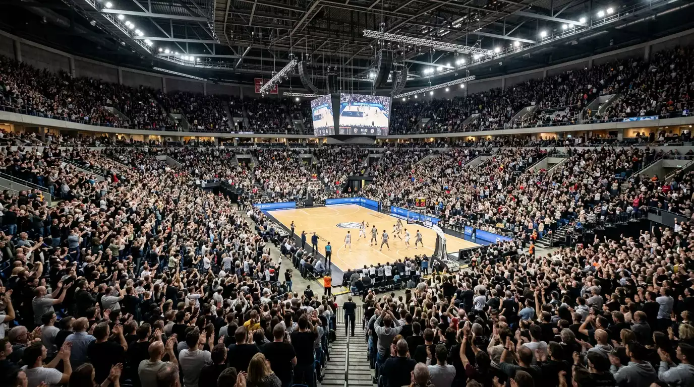 Packed NBA arena with cheering home crowd representing home court advantage in basketball betting